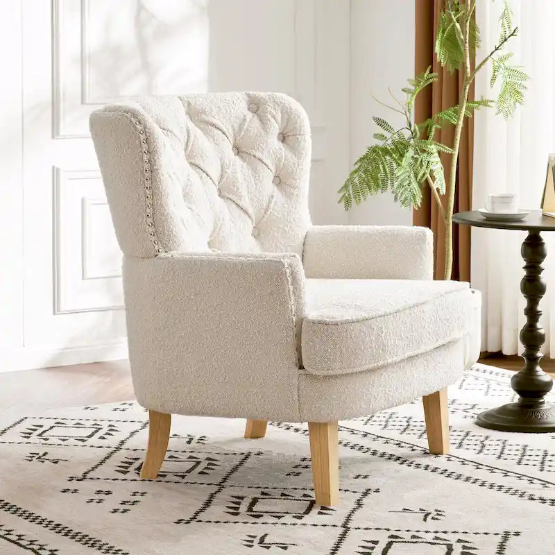 Fauteuil club clouté en bouclette amande