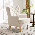 Fauteuil club clouté en bouclette amande